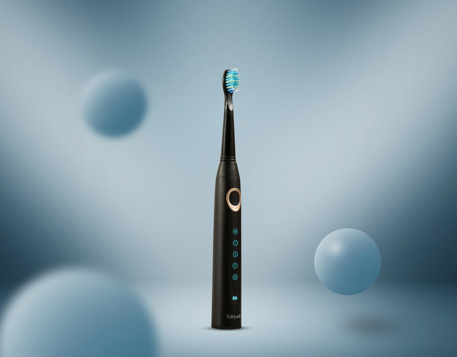 Black electric toothbrush standing upright against a pale blue background